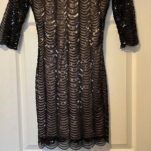 Black sheer, sequin dress with tan under layer. Size small.